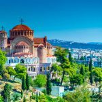 Aerial drone night view of illuminated White Tower in seaside central area of famous city of Thessaloniki or Salonica, North Greece (2)