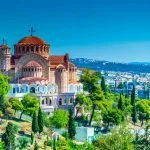 Aerial drone night view of illuminated White Tower in seaside central area of famous city of Thessaloniki or Salonica, North Greece (2)