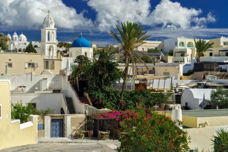 SANTORINI (THERA), CYCLADES, GREECE – South view of traditional village Megalochori with its old style Greek mansions.