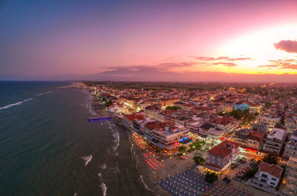 Ultra wide aerial panorama view over the coastal town of Paralia Katerini, Greece at sunset. Located about 8 Km from the city of Katerini in Pieria, central Macedonia, Greece, Europe.