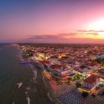 Ultra wide aerial panorama view over the coastal town of Paralia Katerini, Greece at sunset. Located about 8 Km from the city of Katerini in Pieria, central Macedonia, Greece, Europe.