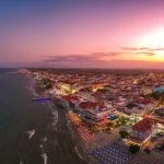 Ultra wide aerial panorama view over the coastal town of Paralia Katerini, Greece at sunset. Located about 8 Km from the city of Katerini in Pieria, central Macedonia, Greece, Europe.
