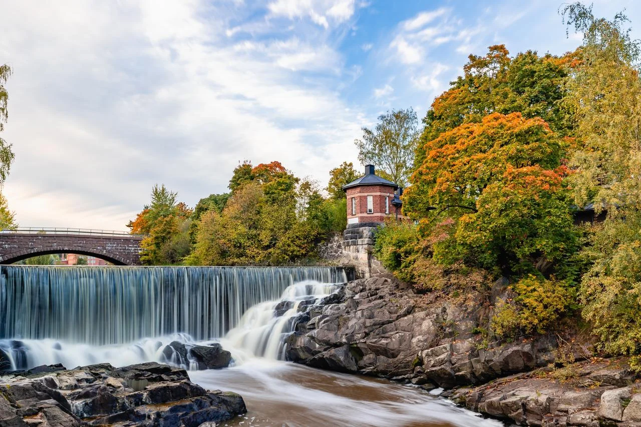 Waterfall of Vanhakaupunki on Vantaanjoki river in Old Town Helsinki at autumn