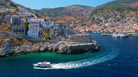 Aerial drone photo of picturesque landmark memorial of Kavos in main port entrance of Hydra or Ydra island, Saronic gulf, Greece