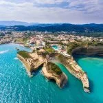Canal D’Amour beach in Sidari, Corfu island, Greece. People bathing in the sun. Turquoise water.