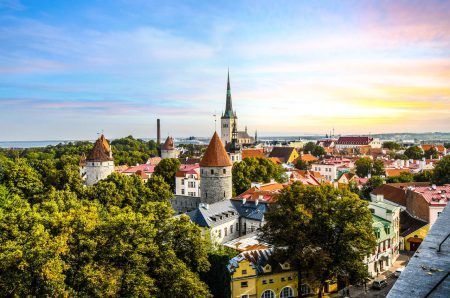 Late afternoon sunset view of the medieval walled city of Tallinn Estonia in early fall in the Baltic region of Northern Europe.