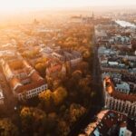 Sunrise view on Krakow main square and streets. Cracow, Lesser Poland province. St. Mary’s Basilica, Rynek Glowny, Wawel castle