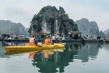 Halong Bay, kayak, couple kayaking in a floating village, Hanoi, Vietnam