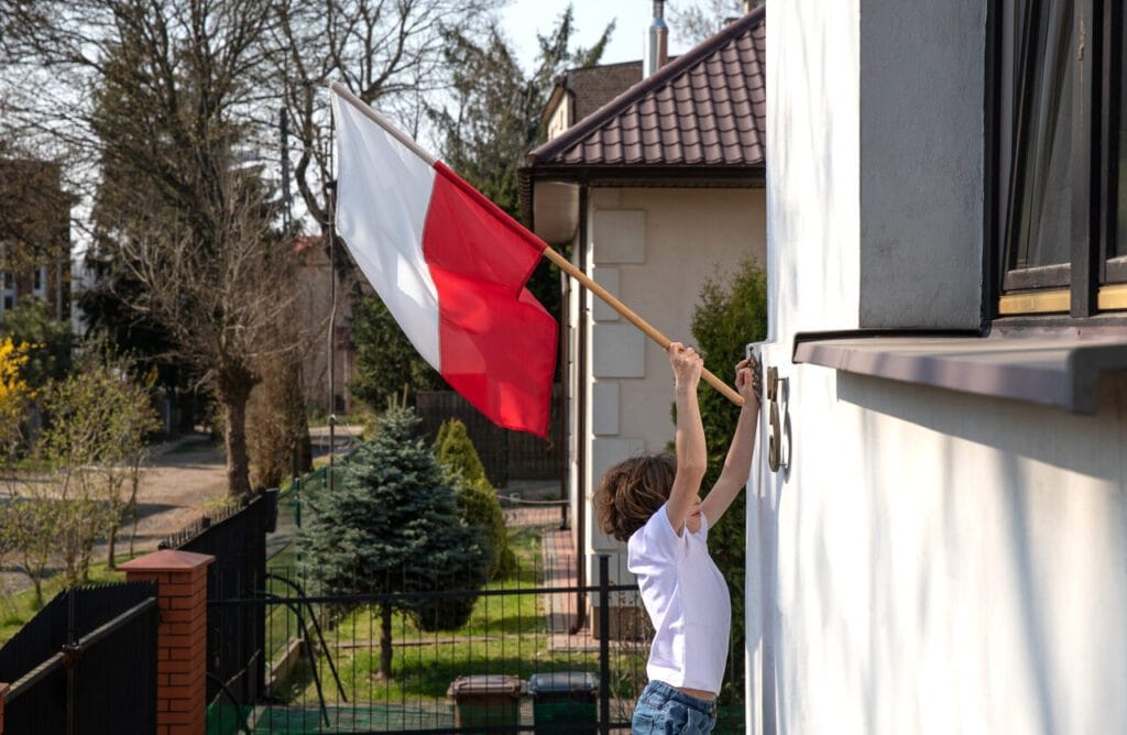 Boy waving a Polish flag